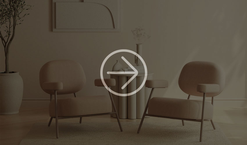 Two beige armchairs next to a round table in a stylish, softly lit room.